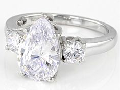 Charles Winston for Bella Luce® white diamond simulant 5.25ctw pear and round platinum over sterling silver ring. Measures approximately 0.88"L x 0.50"W and is not sizable. The diamond equivalent weight is 3.18ctw. Pear-shaped White Cubic Zirconia Ring, White Pear-shaped Cubic Zirconia Ring, Classic Pear-shaped Cubic Zirconia Ring, Pear-shaped Cubic Zirconia Ring With Diamond Accents, Silver Diamond Ring With Pear Shape And Diamond Accents, Silver Diamond Ring With Pear Shape And Accents, Silver Pear-shaped Platinum Ring, Silver Platinum Pear-shaped Ring, Diamond Simulant