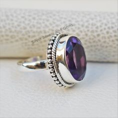 Gemstone-Amethyst Shape-Oval Stone Size - 10x14 MM Metal-925 Sterling Silver This One of a kind ring is adorned with beautiful Purple Amethyst Gemstone in sterling silver.Amethyst is the birthstone representing the month of February. About gemstone-.Amethyst is linked to the element of wind.It is believed to prevent intoxication.This purple gemstone is associated with Royalty.This stone has amazing healing power and very helpful in purifying the mind and relieving stress.Amethyst is the stone of Purple Oval Stone Set Ring, Purple Oval Stone Setting Rings, Purple Oval Ring With Stone Setting, Adjustable Oval Hallmarked Crystal Ring, Fine Jewelry Amethyst Ring In Sterling Silver Oval Shape, Fine Jewelry Amethyst Ring With Oval Stone Setting, Oval Amethyst Sterling Silver Ring For Anniversary, Oval Gemstones With Stone Setting For Anniversary, Oval Amethyst Ring Stamped 925