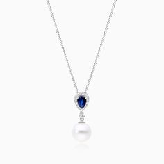 14K White Gold Akoya Cultured Pearl and Sapphire Drop Necklace (9.5mm). Feel glamorous with this stunning 14K white gold drop pendant displaying a deep blue pear shape sapphire with a diamond halo and an Akoya pearl for a soft and elegant look. Pendant measures 23mm in length and 9.5mm width. Elegant Sapphire Teardrop Pendant Necklace, Elegant Sapphire Teardrop Necklace, Elegant Teardrop Sapphire Necklace, Elegant Teardrop Sapphire Necklaces, Elegant Sapphire Drop Necklaces, Fine Jewelry Pear-shaped Sapphire, Elegant Sapphire Pear-shaped Necklace, Elegant Pear-shaped Sapphire Necklace, Formal Sapphire Pear-shaped Necklaces