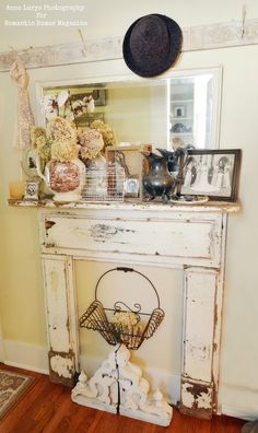 an old dresser with flowers and pictures on it