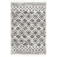 a black and white rug with fringes