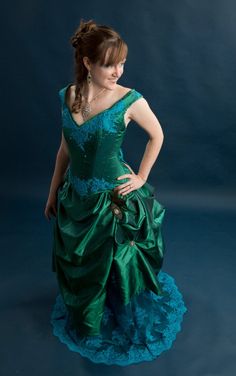 "This stunning handmade Victorian wedding gown was made for an Exhibit in the Springfield WVS art Museum where it was on display for 8 months in 2014. The corset features an emerald jewel toned taffeta hand appliqued with turquoise Indian lace, accented with swarovski crystals and swarovski rhinestones. It is boned with a combination of flat and spiral steel and has a strength layer of German coutil. The over skirt is made of the same taffeta accented with vintage rhinestone and stamped silver j Victorian Wedding Gown, Over Skirt, Fairy Wedding, Victorian Wedding, Hand Applique, 8 Months, Fabulous Fashion, Vintage Rhinestone, Wedding Gown