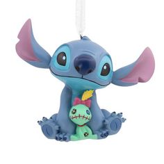 That lovable alien "dog" and a ragged, homemade doll may be small, and a little broken, but to Lilo they were always family. Celebrate your own ohana with this cute Christmas tree ornament of Stitch and Scrump. "Lilo & Stitch" fans will love to add these iconic characters to the holidays. Hallmark Ornaments are a great way to commemorate hobbies, life events and individual interests in entertainment, sports and more. Each festive and collectible ornament is perfect for sharing with family and friends. Disney Stitch With Scrump, Scrump Lilo And Stitch, Stitch And Scrump, Alien Dog, Lilo En Stitch, Disney Christmas Ornaments, Unicorn Ornaments, Homemade Dolls, Lilo Y Stitch