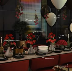 a table topped with lots of plates and vases filled with flowers next to balloons