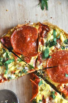 slices of pepperoni pizza sitting on top of a wooden cutting board