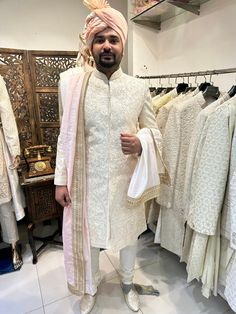 Intricately hand embroidered sherwani to set you apart from regular mundane wear. Ceremonial Raw Silk Sherwani With Naqshi, Ceremonial Naqshi Sherwani In Raw Silk, Traditional Raw Silk Sherwani With Resham Embroidery, Elegant Raw Silk Sherwani With Intricate Embroidery, Elegant Raw Silk Sherwani With Traditional Drape, Traditional Sherwani With Intricate Embroidery For Transitional Season, Traditional Raw Silk Sherwani With Intricate Embroidery, Ceremonial Sherwani With Intricate Embroidery In Raw Silk, Eid Raw Silk Sherwani With Intricate Embroidery