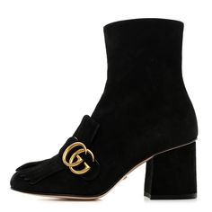 This is a fabulous pair of authentic GUCCI Kid Scamosciato GG Marmont Fringe 75mm Ankle Boots size 35 in Black. These boots are mid length on the leg and crafted of black suede. These boots feature a 2.75 inch heel, an antique gold GG logo, and a zipper on the inside. Gucci Kids, Gg Logo, Gg Marmont, Black Suede, Antique Gold, Mid Length, Ankle Boots, Gucci, Zipper