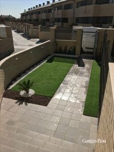 an aerial view of a courtyard with artificial grass