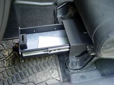 the inside of a car with an electronic device in it's center console area