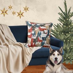 a dog laying on the floor in front of a christmas tree with stars hanging from it