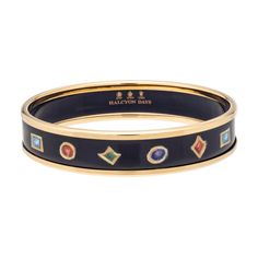 This enamel bangle has been handcrafted and decorated in England by the Halcyon Days artisans.

It features a charming jewels design drawn by close Halcyon Days collaborator and New York based illustrator Tug Rice. 

Its raised rims are plated with 18ct gold. Halcyon Days, Scarf Necklace, Enamel Bangle, Bespoke Gifts, Crown Jewels, Navy Gold, Hinged Bangle, Fine Bone China, Mugs Set