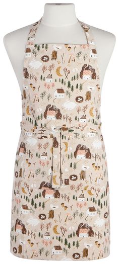 an apron on a mannequin with trees and animals in the woods printed on it