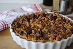 a pecan pie sitting on top of a wooden table