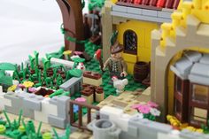 there is a toy house made out of legos that are in the shape of a village