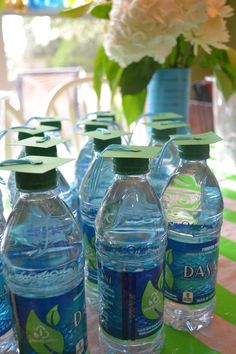 several bottles of water sitting on top of a table