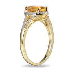 Make a stylish statement with this stunning yellow-gold citrine and lab-created white sapphire fashion ring. Sterling silver with 18K gold plate. The ring showcases a 9.0 x 6.0mm pear-shaped golden-yellow citrine center stone. White lab-created sapphires border the citrine and line the ring's split shank. Exquisite Gold Sapphire Ring With Accent Stones, Luxury Yellow Sapphire Rings With Diamond Accents, Luxury Gold Sapphire Ring With Accent Stones, Luxury Yellow Topaz Ring With Diamond Accents, Yellow Gold Citrine Diamond Ring With Accents, Yellow Gold Diamond Ring With Citrine Accents, Exquisite Yellow Gold Topaz Ring With Prong Setting, Luxury Topaz Rings With Rose Cut Diamonds, Citrine Center Stone Topaz Ring