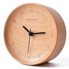 a wooden clock with black hands on a white background