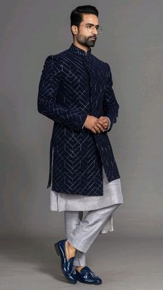 a man in a blue and white sherwa