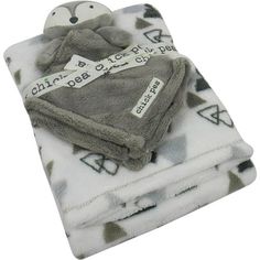 two baby blankets are folded up on top of each other, one has a tag that says