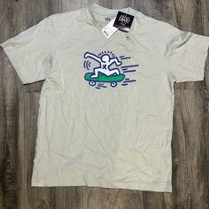 Uniqlo Keith Haring Skateboarding Print Light Khaki T-Shirt Nwt Perfect Condition Size M Casual Skateboarding Top With Front Print, Casual Tops With Front Print For Skateboarding, Casual Front Print Tops For Skateboarding, Casual Graphic Print Tops For Skateboarding, Casual Shirt With Front Print, Casual White Top For Skateboarding, Uniqlo Graphic Tee With Crew Neck, Urban Tops With Logo Print For Skateboarding, Urban Crew Neck Tops For Skateboarding