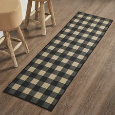 a black and white checkered rug on the floor