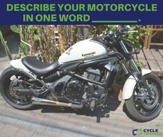 there is a motorcycle that is parked on the street with words describing how to describe your motorcycle in one word