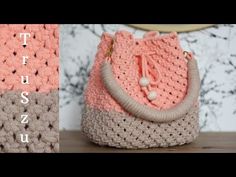 a crocheted purse sitting on top of a wooden table next to a wall