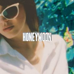 a woman wearing sunglasses with the words honey moon in front of her