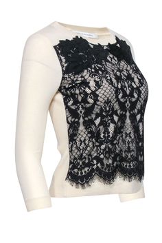 A festive or mysterious lace sweater by Diane von Furstenberg; you decide the mood with the occasion! This classic fit sweater pairs perfectly with cropped black pants and a black pump for a chic take on holiday party dressing, or with a leather pencil skirt for a look that is both pretty and edgy. Size P 90% Wool, 8% Nylon, 2% Spandex Combo 100% Nylon Lace overlay detail Ribbed back Bust 33" Waist 29" Shoulder to hem 20.5" Sleeve length 19.5" Elegant Stretch Sweater For Party, Elegant Black Lace Top For Layering, Elegant Sweater For Night Out In Spring, Elegant Spring Sweater For Night Out, Elegant Black Tops With Contrast Lace, Winter Crew Neck Sweater With Lace Trim, Black Crew Neck Sweater For Evening, Elegant Evening Sweater With Crew Neck, Elegant Crew Neck Sweater For Party