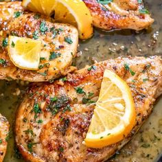 chicken with lemons and herbs cooking in a pan