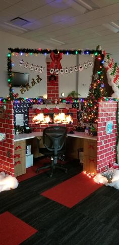 an office decorated for christmas with lights and decorations on the walls, fireplaces and desks