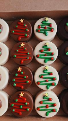 a box filled with lots of decorated cupcakes