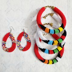 These beautiful Maasai beaded Earrings will make you look your very best wherever you go. Beautiful, hand beaded earrings are handmade by Maasai women artisan in Kenya These traditional earrings have become very popular over the years and can be worn from casual and formal events year round. Note: As with all handcrafted products colours, design patterns and size my very. Note: Bracelet sold separately Handmade in Kenya Drop length: 3 Inches Materials: Maasai beads Closure: Ear wire Traditional Beaded Hoop Earrings, Handwoven Beaded Bracelets With Round Beads, Traditional Red Beaded Earrings With Colorful Beads, Traditional Multicolor Beaded Earrings, Traditional Beaded Hoop Earrings For Festive Occasions, Traditional Round Beaded Earrings With Large Beads, Handmade Round Beaded Earrings For Festivals, Traditional Festive Beaded Hoop Earrings, Traditional Polished Beads Earrings For Gifts