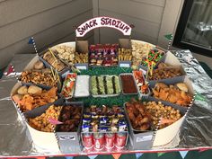 an assortment of snacks are displayed on a table