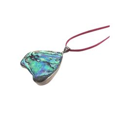 Free form piece of abalone shell set into a silver frame with a silver bale hanging from a cord necklace that must be tied so it is adjustable. Marked silver inside bale. Cord: Length 18.5 inches Height: 0.12 Width: 0.06 Pendant: Height: 2 in Length: 1.75 in Width: 0.25 in    Due to the unique nature of this product, all sales are final. This item is not eligible for the standard Chairish return policy. Sterling Pendant, Unique Nature, Abalone Shell, Cord Necklace, Organic Modern, Silver Frame, Turquoise Bracelet, Antique Jewelry, Vintage Antiques