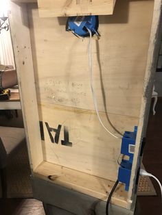 an electrical box is being installed in the back of a truck with wires attached to it