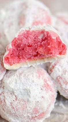 some pink and white desserts are on a plate