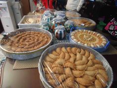 several trays of pastries on a table