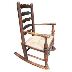 an old wooden rocking chair on a white background