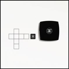 a crossword puzzle with the image of a chanel logo on it and two black squares