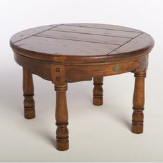 an old wooden table with two legs and a small round top on the bottom, sitting against a white background