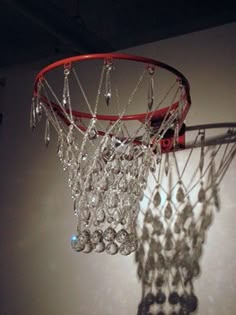 a basketball hoop with crystal beads hanging from it