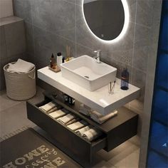 a bathroom with a sink, mirror and towel rack in the middle of the room