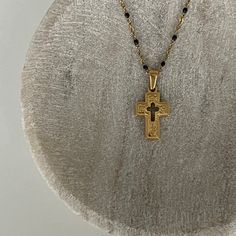 Our Petra Cross Pendant Necklace features a dainty chain with sleek black enamel details, with a dual sided cross. Perfect for everyday wear or to layer with your favorite pieces. Don't be afraid to mix and match to create your own signature style - I know we would! Details Waterproof & Sweat Resistant Chain Material: Stainless Steel dipped in 18k gold and black enamel Closure: Lobster Clasp Chain Length: 16'' with 2'' Extend Pendant Measurements: 25mm x 15mm Nickel-free Gold Cross Necklace, Black Cross Jewelry With Adjustable Chain, Black Cross Necklace With Clavicle Chain, Black Cross Pendant Clavicle Chain Jewelry, Minimalist Black Cross Pendant Jewelry, Minimalist Black Cross Pendant Necklace, Minimalist Black Cross Jewelry, Black Jewelry With Adjustable Chain And Cross Pendant, Black Metal Cross Necklace With Adjustable Chain