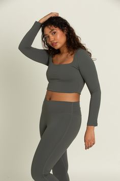 Dull Pine Square Neck Long Sleeve Top is the year round staple you've been missing. It features a flattering square neckline to make any look more sophisticated and built-in removable padding for your preferred amount of support. Pair with our Dull Pine Flare Yoga Pants for the perfect set. Stretch Square Neck Top With Built-in Bra, Square Fitted Top Solid Color, Bra-friendly Solid Color Square Neck Top, Square Neck Bra Friendly Solid Top, Fitted Solid Color Square Top, High Stretch Seamless Square Neck Top, Square Neck Top With Built-in Bra, Fitted Square Neck Top Bra Friendly, Square Neck Tops With Built-in Bra