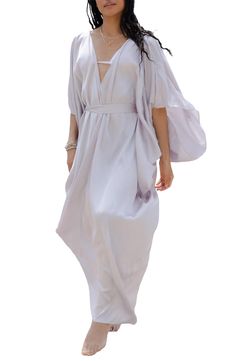 Perfect for poolside hangs or kicking it in the sand, this tie-front kaftan is the perfect accessory to add to your sun-loving wardrobe. V-neck
 Short sleeves 100% polyester satin Hand wash, line dry
 Imported Model stats: 5'10", 32" bust, 25" waist, 36" hip. Model is wearing size One Size. Chic Summer Wrap Cover-up, V-neck Tie Waist Beach Cover-up, Elegant Spring Kaftan For Beach Cover-up, Chic Wrap Cover-up For Spring, Chic Spring Unlined Cover-up, Chic Unlined Spring Cover-up, Unlined V-neck Cover-up For Vacation, V-neck Beach Dress With Tie Waist For Vacation, V-neck Summer Kaftan For Vacation