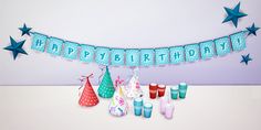 a happy birthday banner with candles and decorations