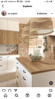 the instagram page shows an image of a kitchen with white cabinets and wooden counter tops