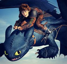 a young boy riding on the back of a black dragon in front of a blue sky