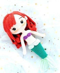 the little mermaid doll is knitted in white and green